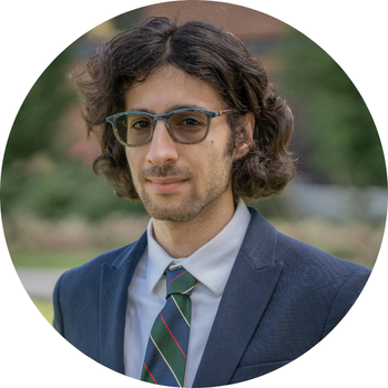 Photo of Adrian in a suit