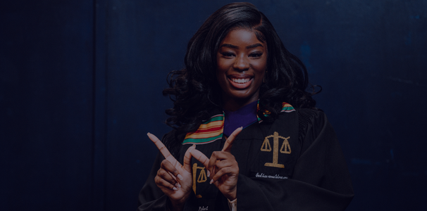 Windsor law student doing the W sign in convocation robe
