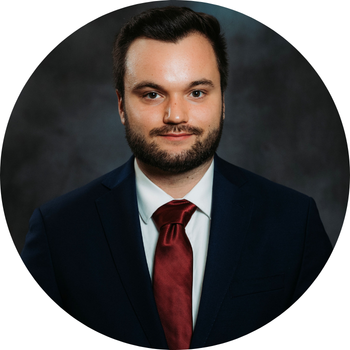 Photo of Colin in a suit
