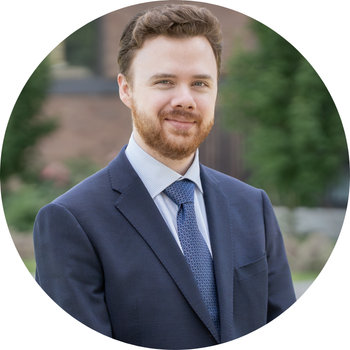 Photo of Keegan in a suit
