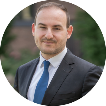 Photo of Matthew in a suit