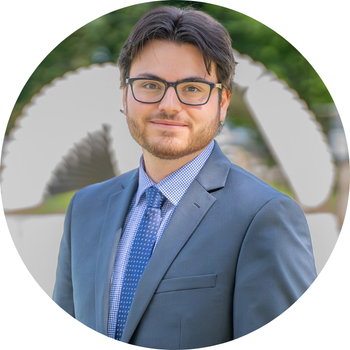 Photo of Shane in a suit