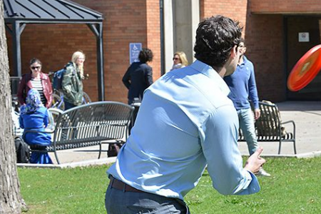 Students Playing Frisbee