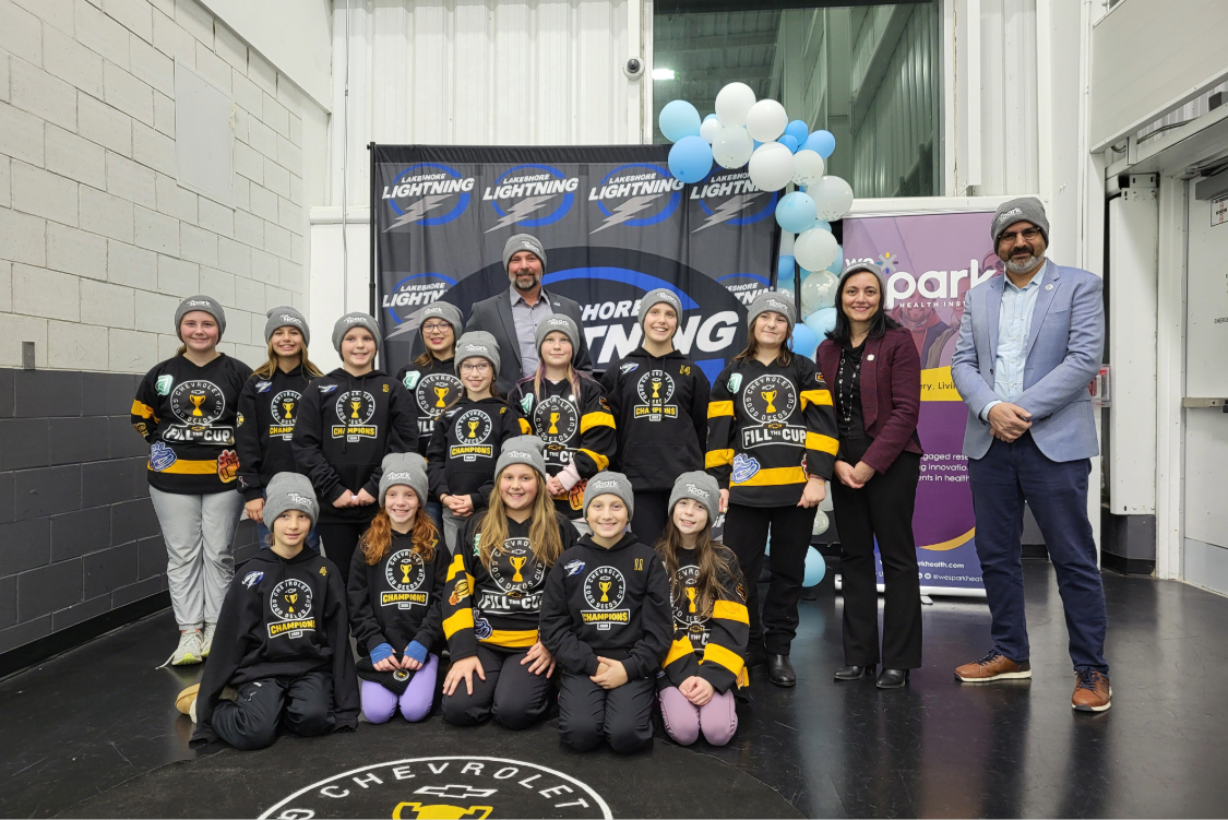 team celebrating big donation