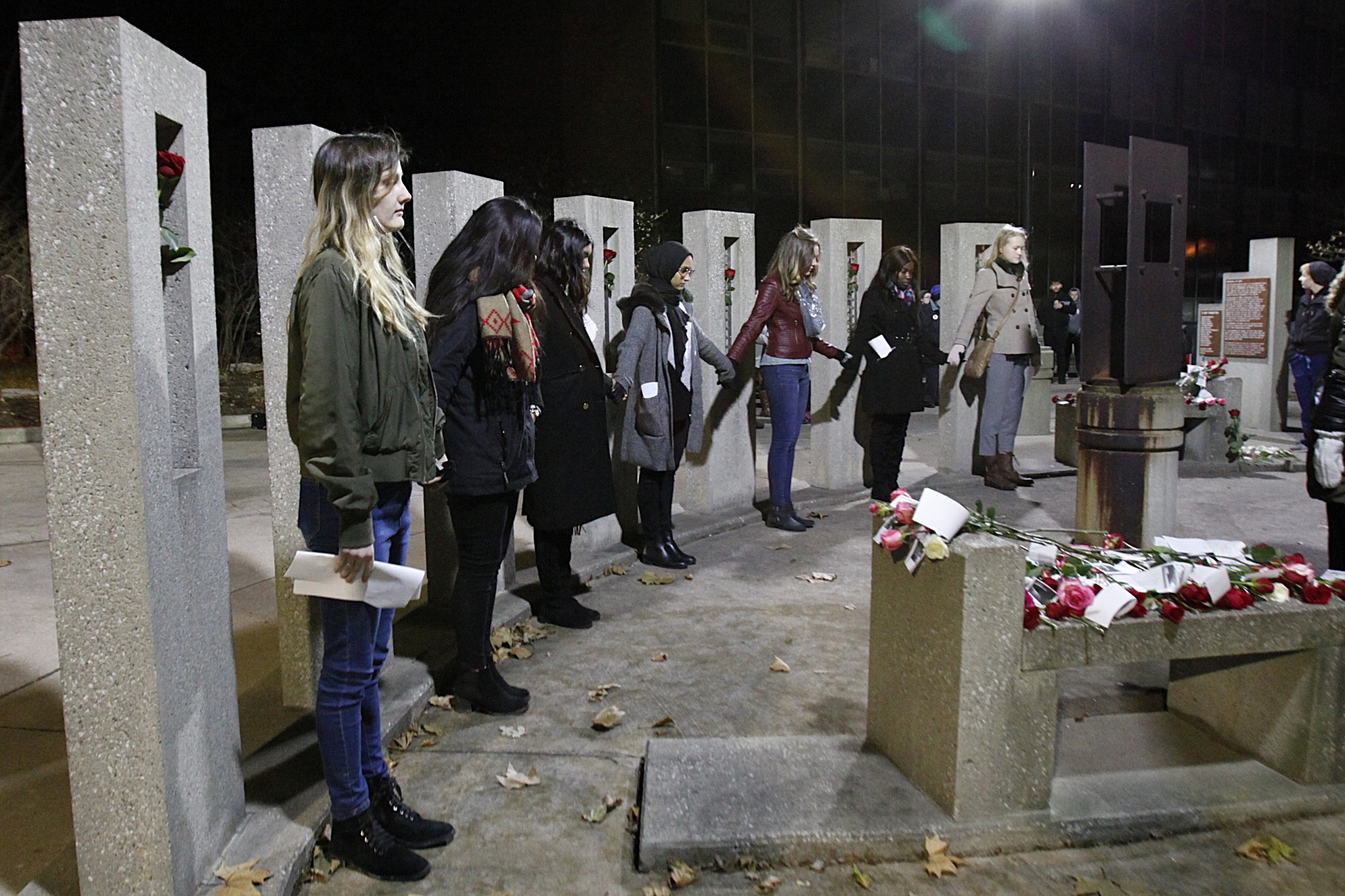 Students stand in front of the Memorial of Hope at UWindsor