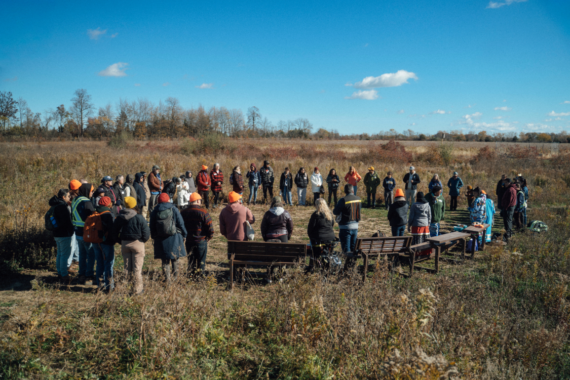 Group participating in the first water ceremony held at a Caldwell First Nation wetland restoration site 