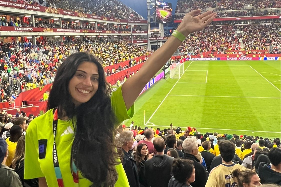 Casandra Asoufi with her arm raised in the World Cup stadium in Toronto