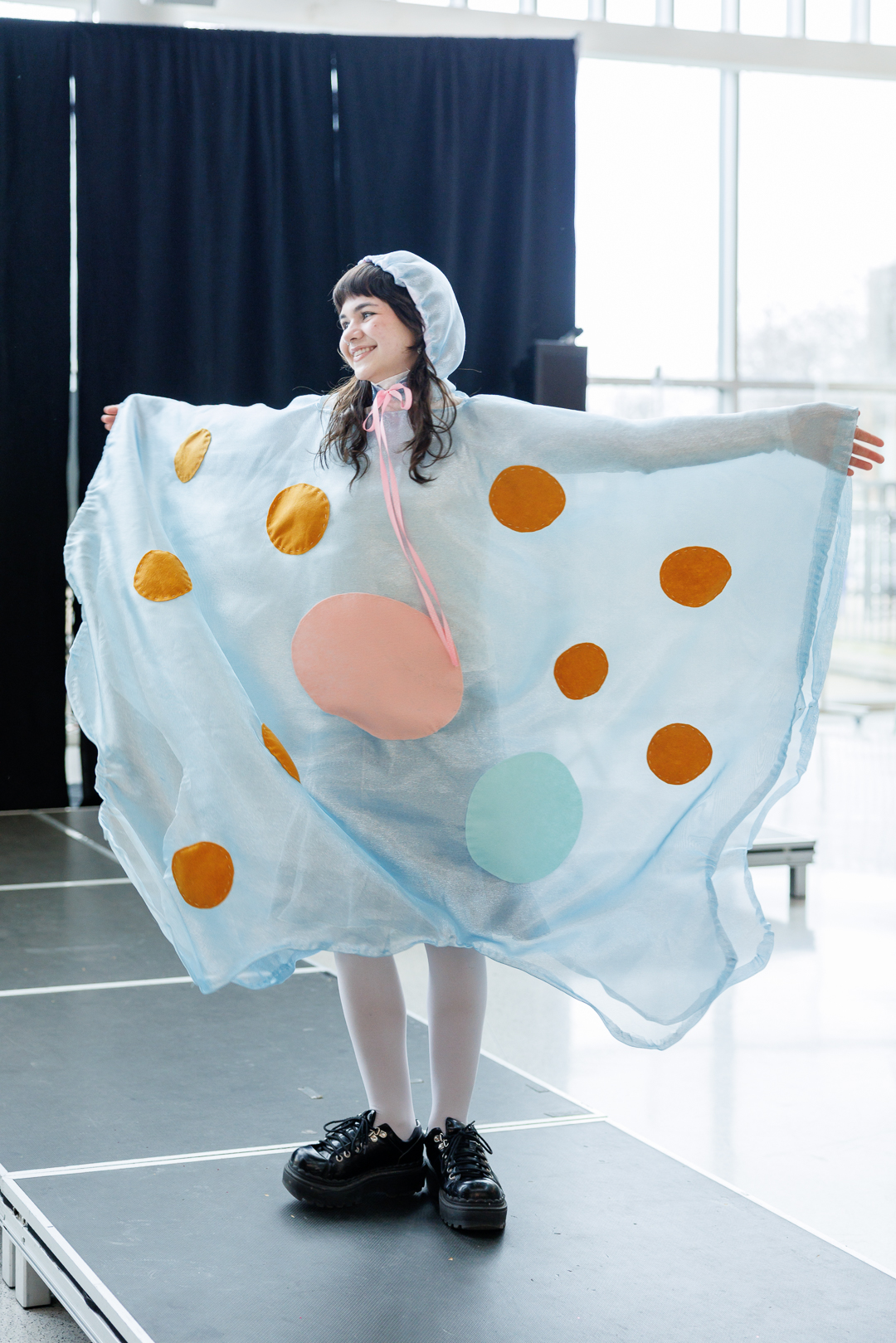 A student in a bonnet and billowing amoeba costume