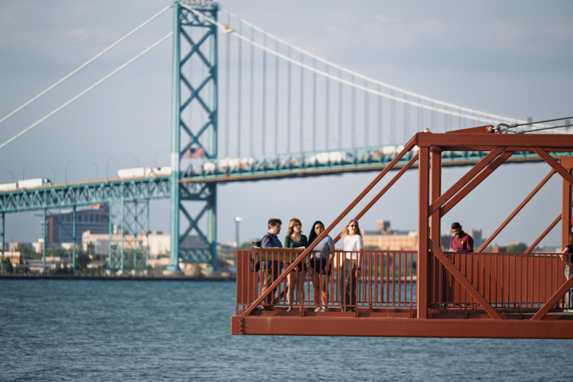 Jason Grossi and students on pier