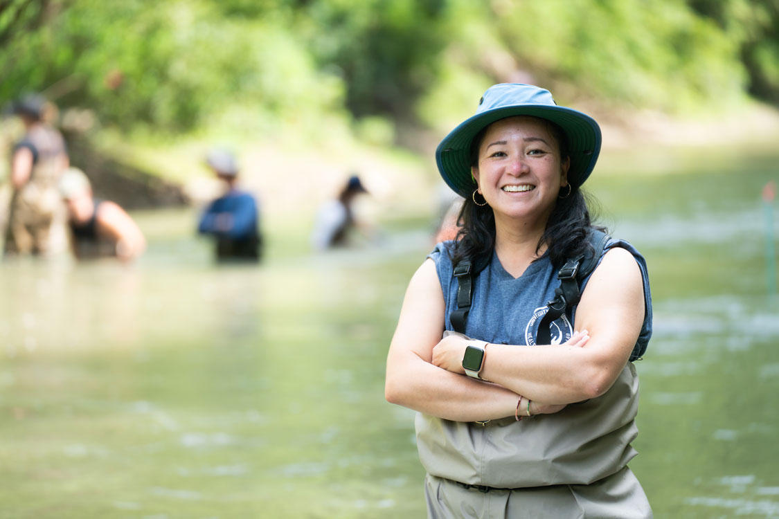University of Windsor researcher Catherine Febria conducts freshwater fieldwork in the Sydenham River as part of her research on ecosystem restoration and watershed health.