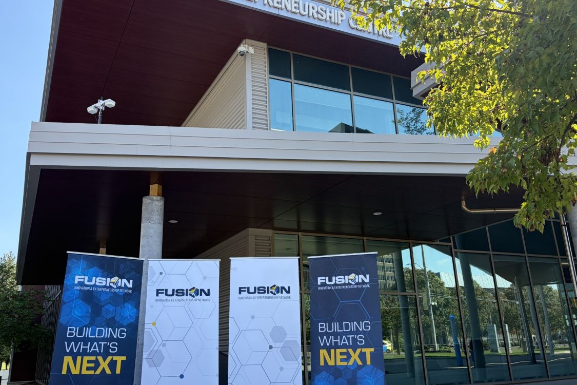 front of Joyce building with Fusion banners