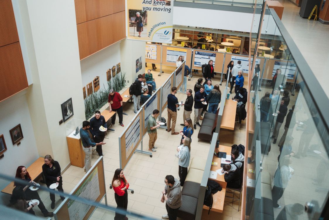 overhead shot of people viewing posters in the HK building