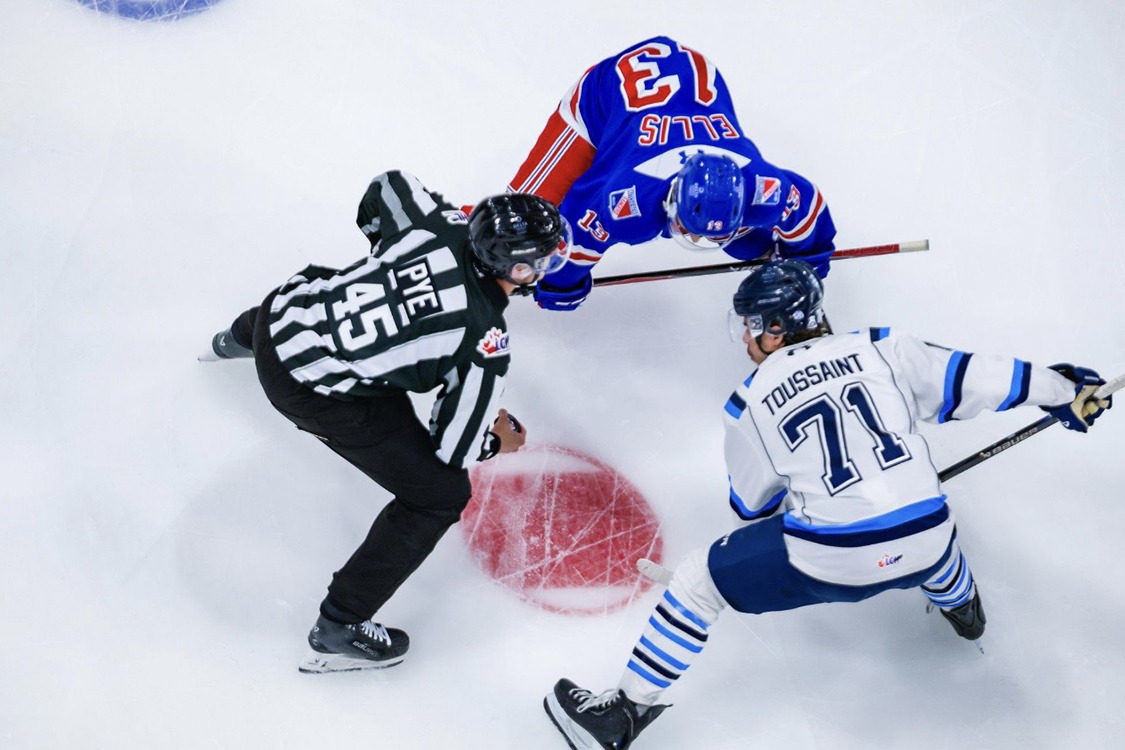 photo of Luke Pye at face-off circle ready to drop the puck