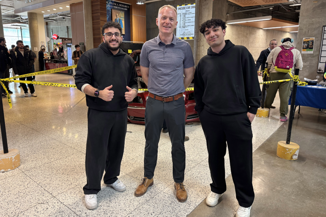 Students with Dean of Engineering Bill Van Heyst at car smash event