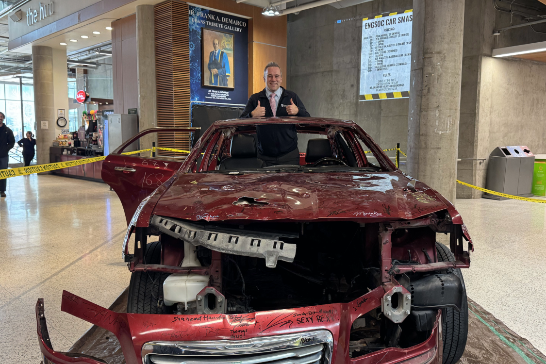 Acting associate dean Darryl Danelon at car smash event