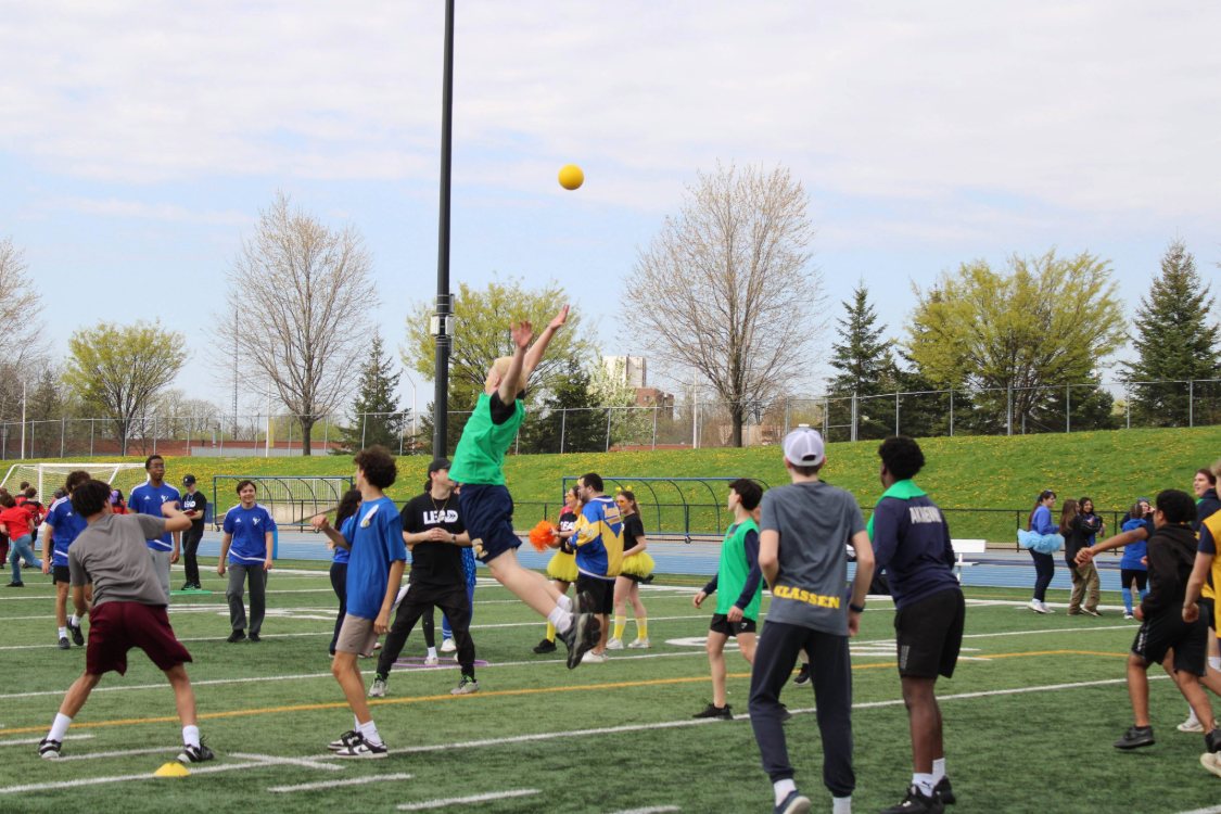 High school students play sports on the alumni field