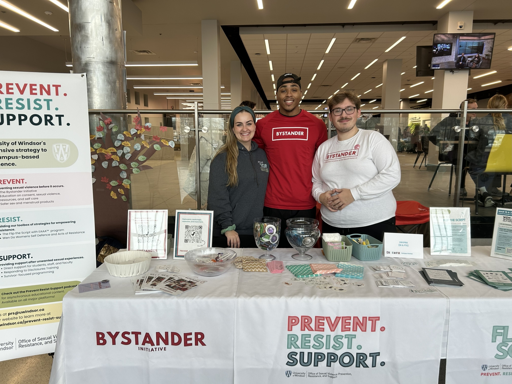 Bystander Initiative representatives at a booth at the student centre