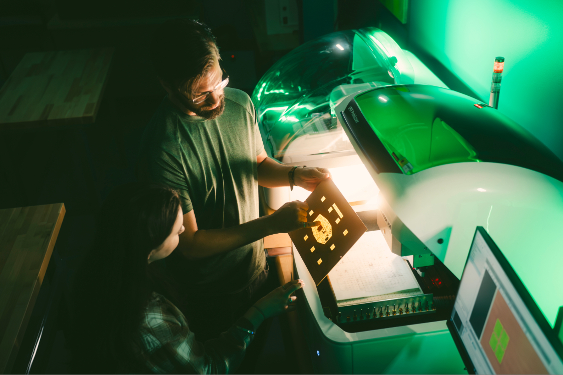 Second-year engineering student, Jade Demers, and Calvin Love, engineering systems developer/integrator, working in the newly opened IDEA Lab at the University of Windsor.