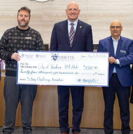 Photo of members of City Hall, Odette School of Business and the Farrow Family Foundation holding the donated cheque