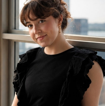 photo of Abigail seated near a window