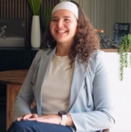 Mia Kairouz sitting