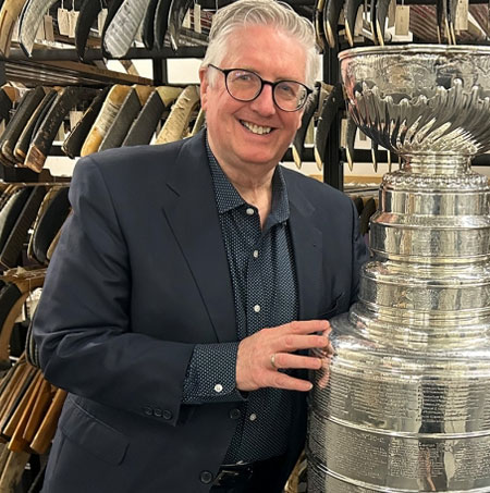 Kevin Shea poses with the Stanley Cup