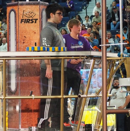 Students work on a robot in front of a crowd at the St. Denis Centre at UWindsor