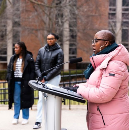 Shetina Jones speaks at the Pan-African flag raising