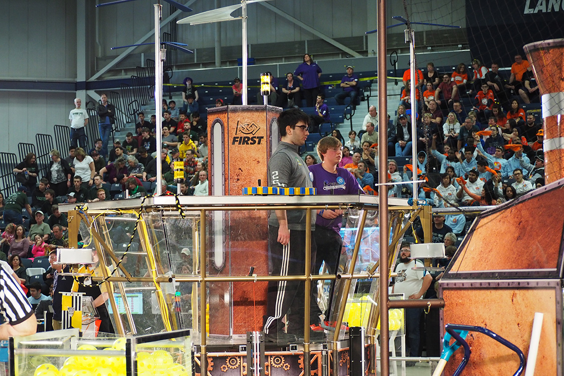 Students work on a robot in front of a crowd at the St. Denis Centre at UWindsor