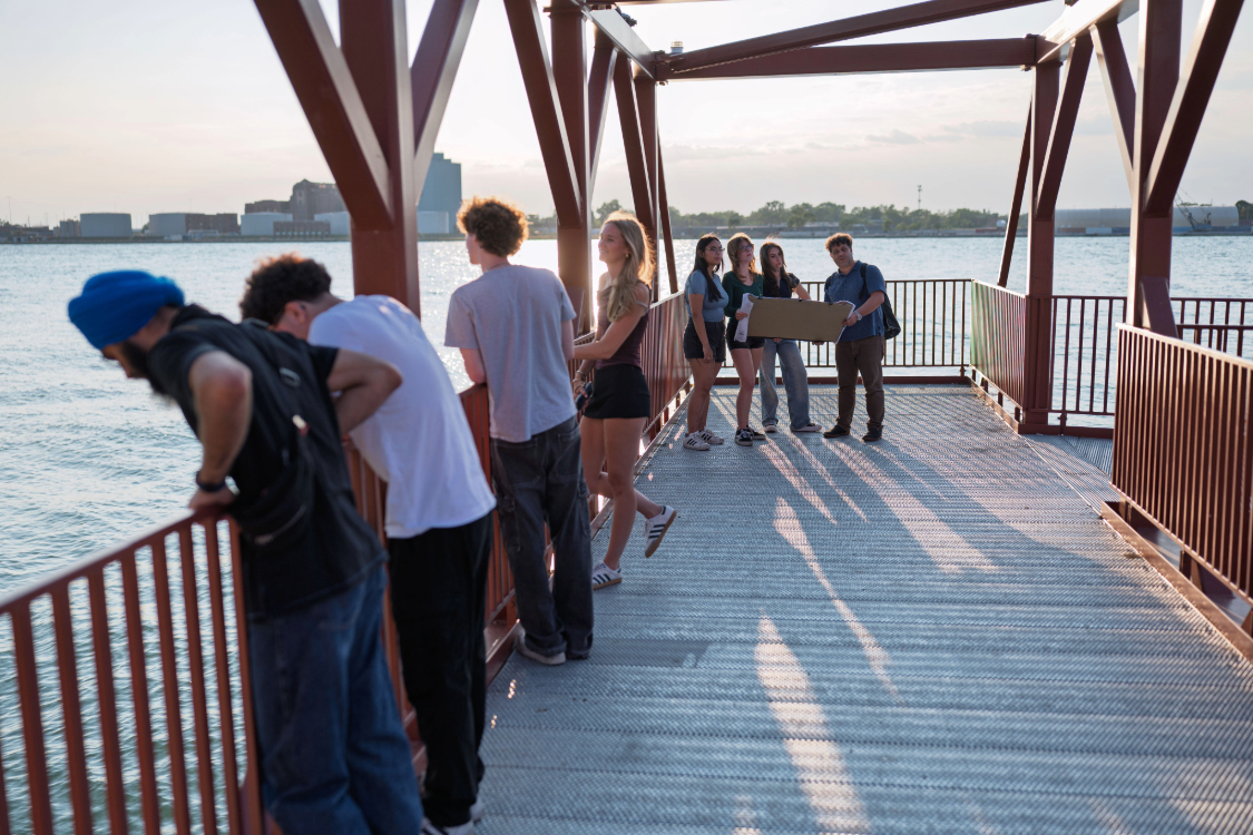 Jason Grossi and students at pier
