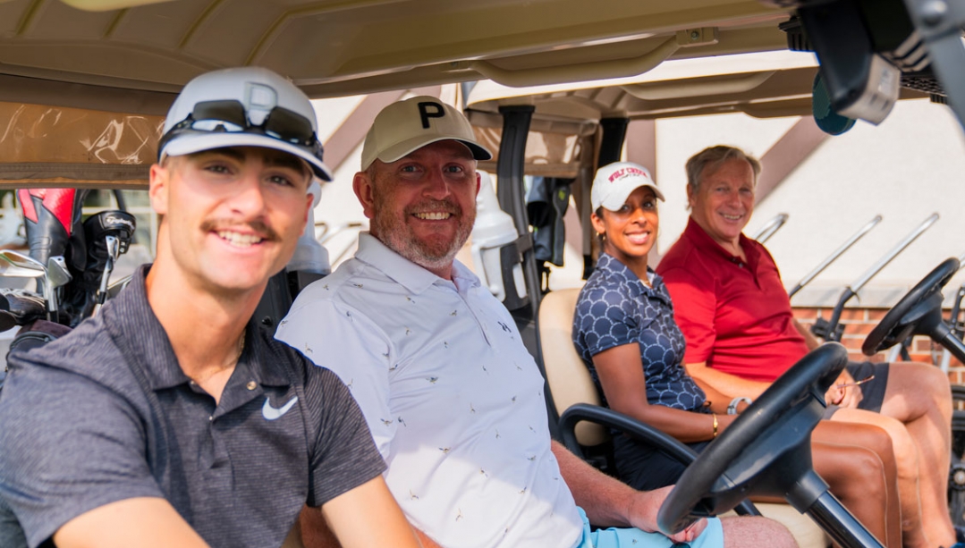 Golfers in golf carts