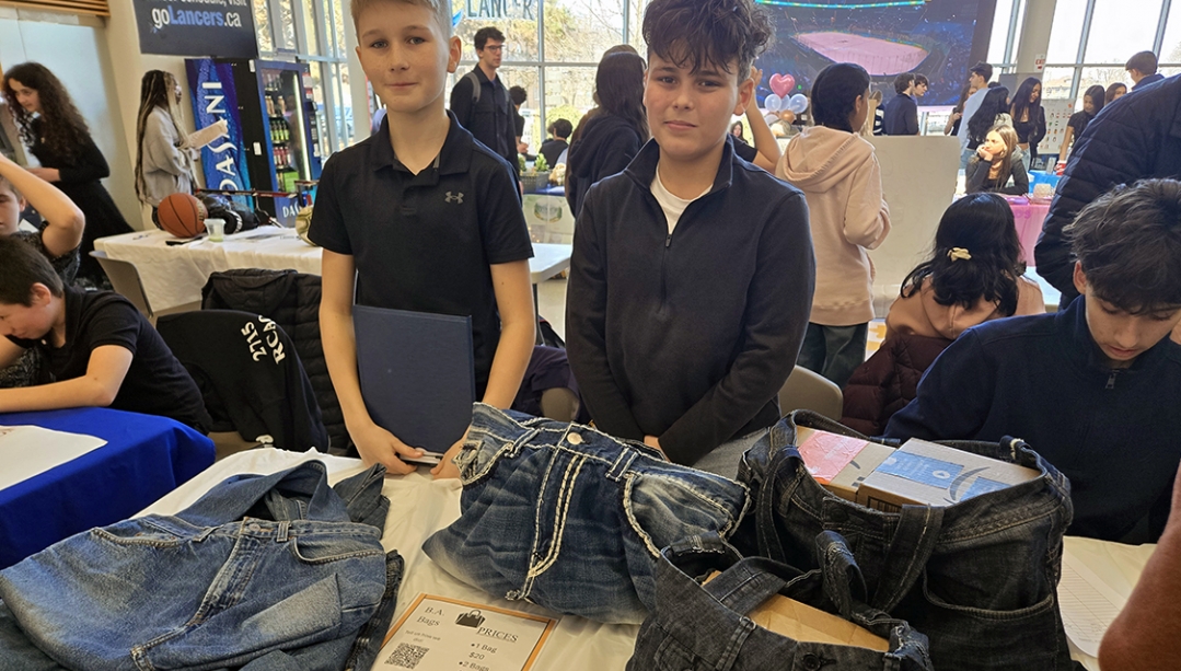 Two elementary students from Legacy Oak Trail Public School at their booth