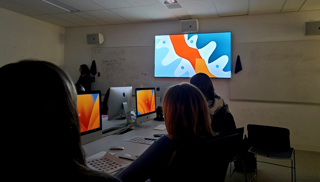 students in a classroom watching stop-motion videos on a screen