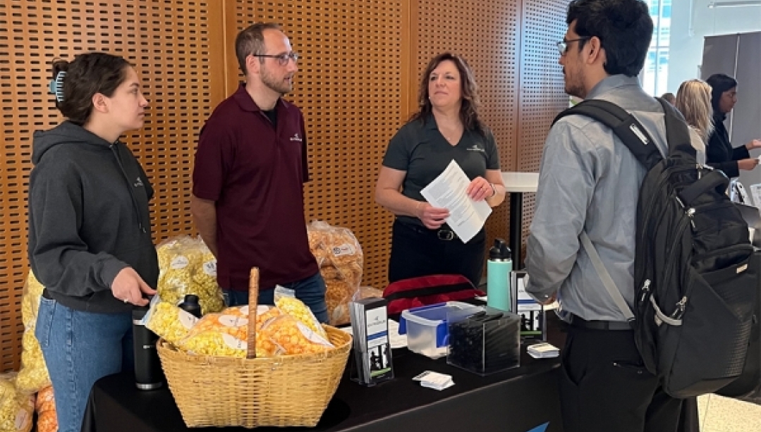Engineering Job Fair booth featuring employers and job prospect.