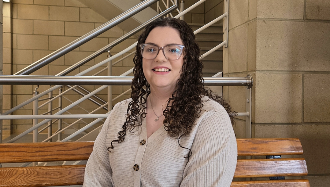 photo of Amanda Muzzatti seated in the Odette Building lobby