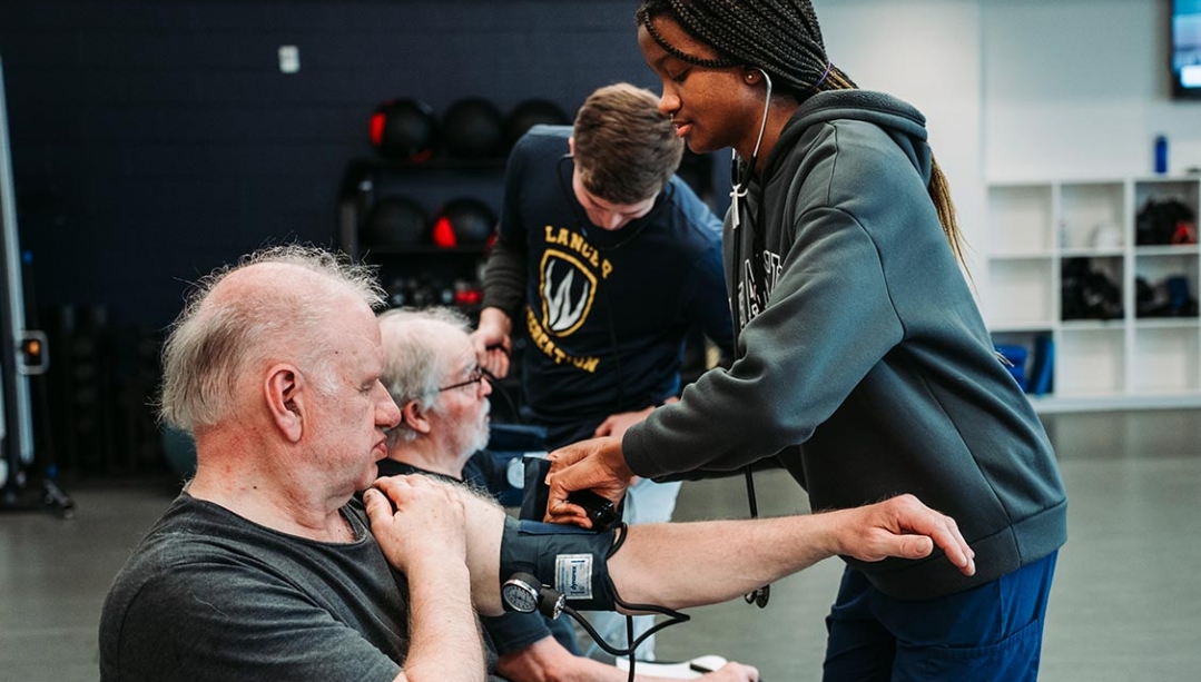 Cardiac Wellness Program participants have their vitals taken before class