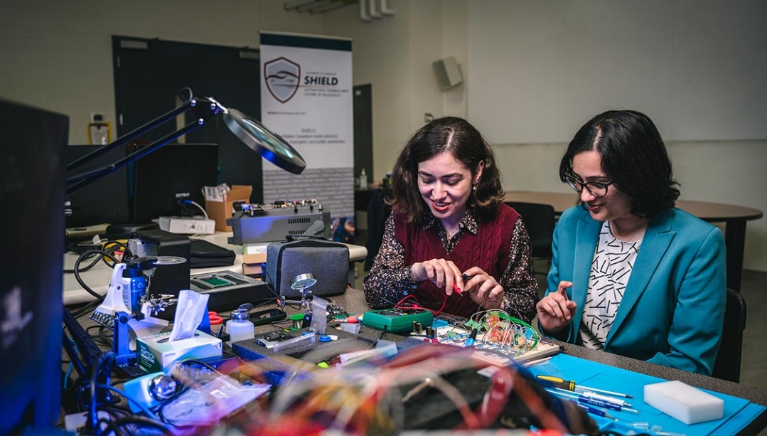 Shiva Nejati and Kunj Dhonde working on circuitry