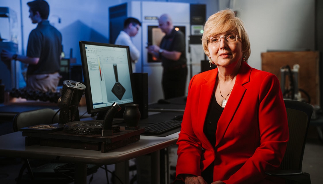 Dr. Jill Urbanic sitting in her lab