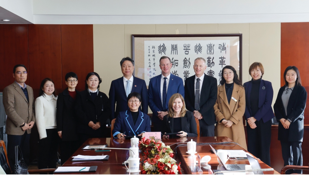 Senior leads from University of Windsor and Beijing City University at MOU signing.