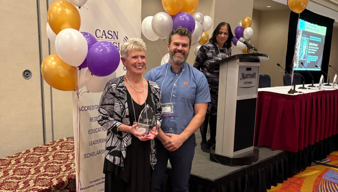 Dr. Rickeard receiving CASN award 