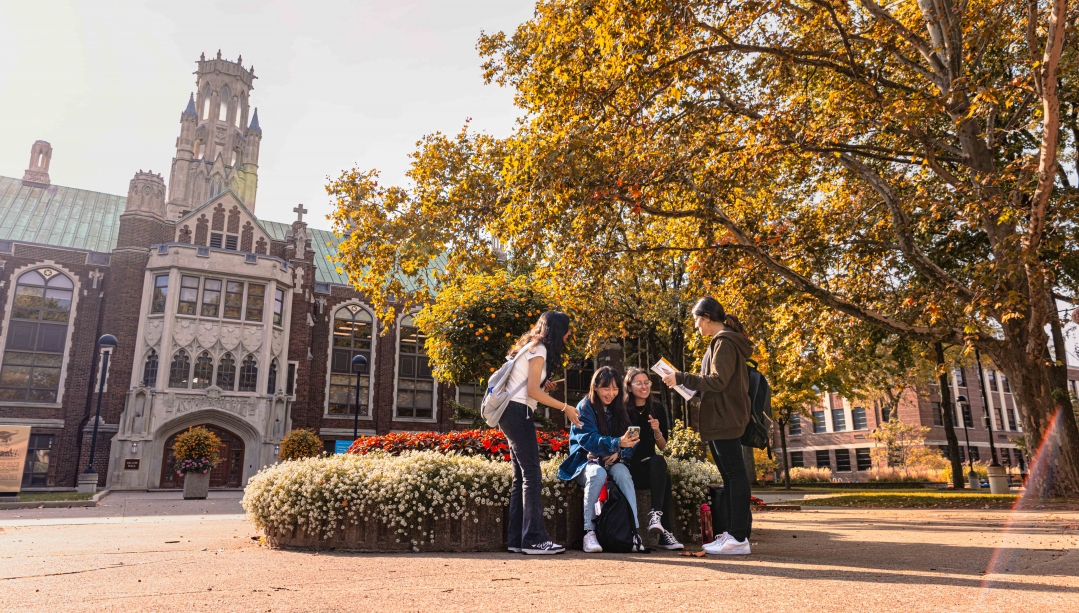 Students sitting outside Dillon Hall