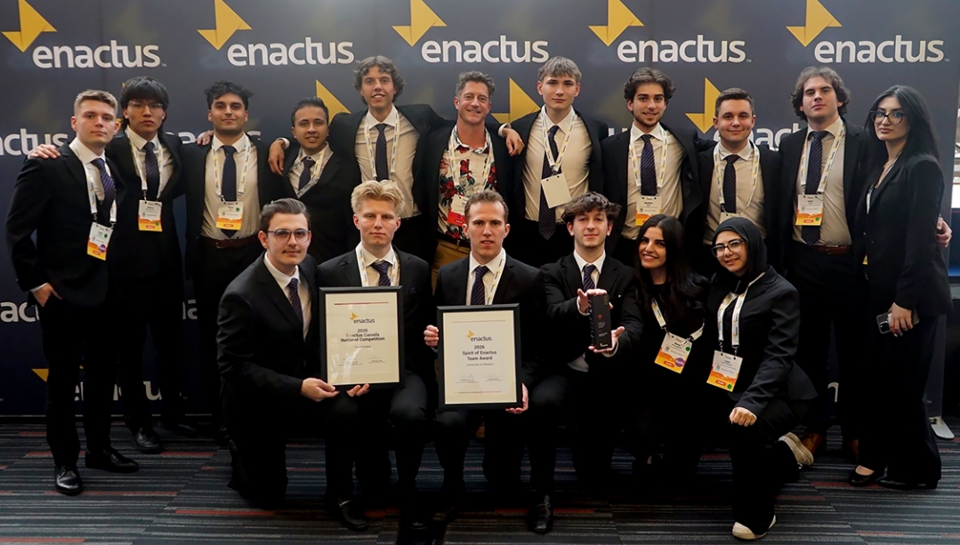 photo of entire Enactus Windsor team members holding their awards