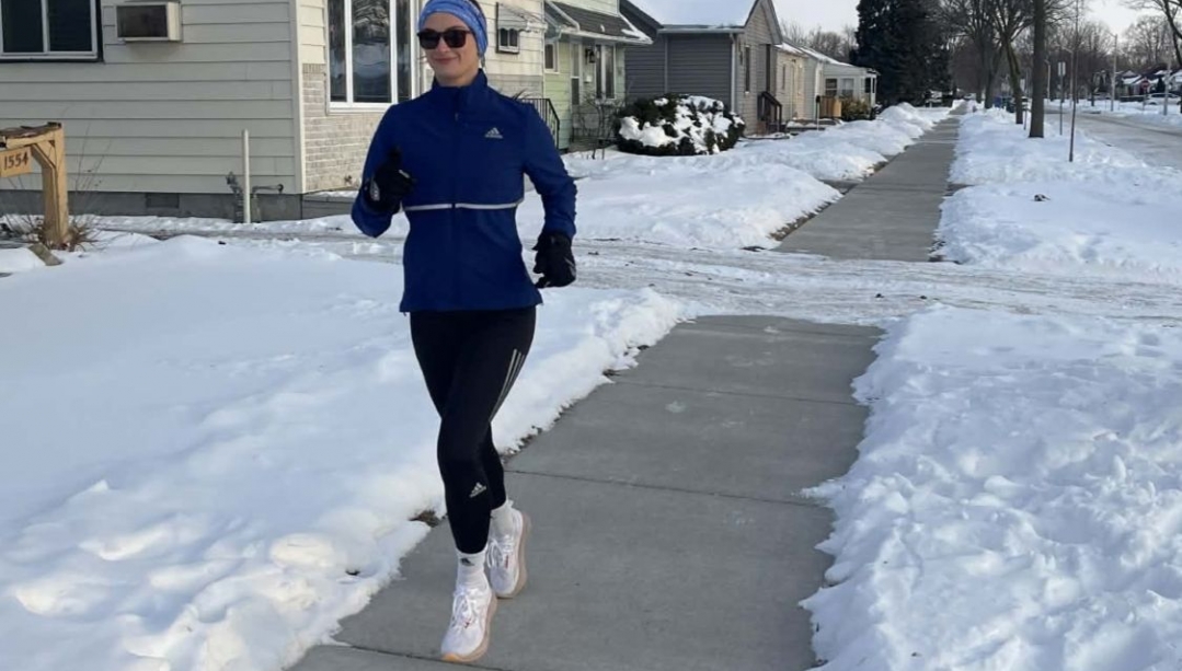 Brittany Bellemore runs in the snow