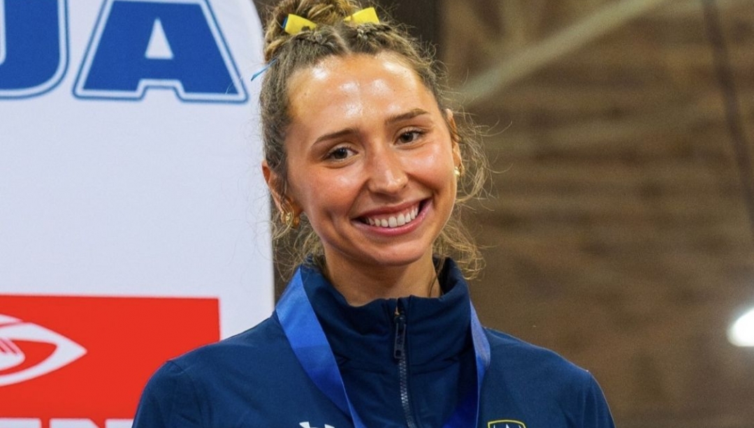 Chloe VidAmour smiling and wearing a medal