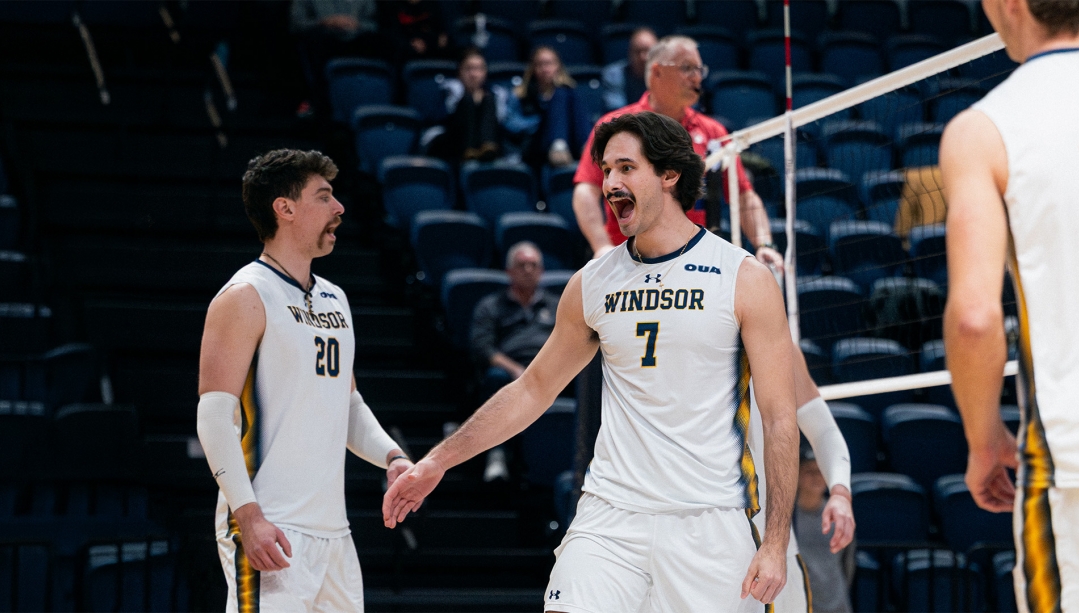Anthony Ivanovski celebrates a point on volleyball court.