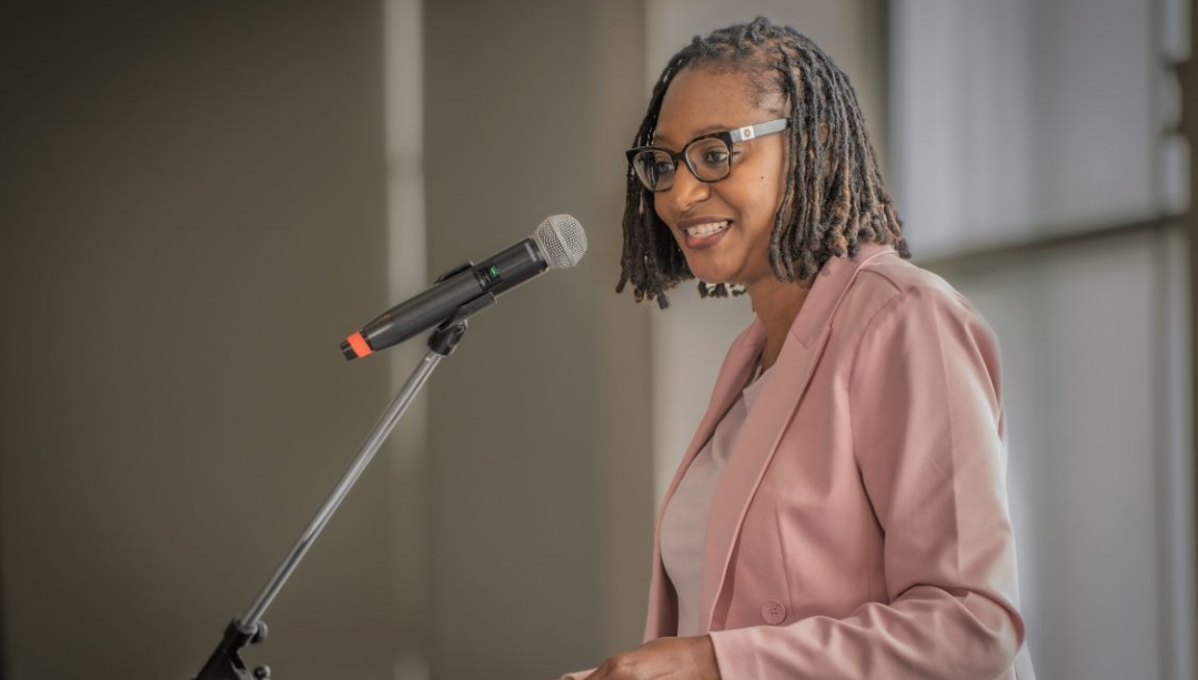 Joan Simpson speaking at a podium