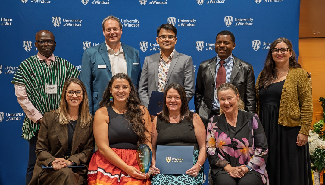 President J.J. McMurtry stands with Equity, Diversity and Inclusion Awards recipients.