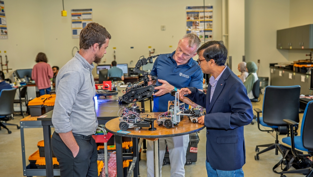 Fulbright specialist Dr. Chris Kelley, a professor from Florida Polytechnic University (left), in the mechatronics lab at the University of Windsor with Dean of Engineering Dr. Bill Van Heyst and professor Dr. Jalal Ahamed. (KYLE ARCHIBALD/The University 