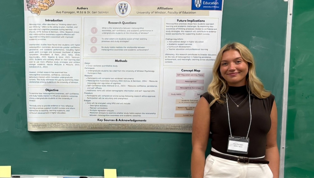 Ava Flanagan standing next to the academic poster for her metacognition research