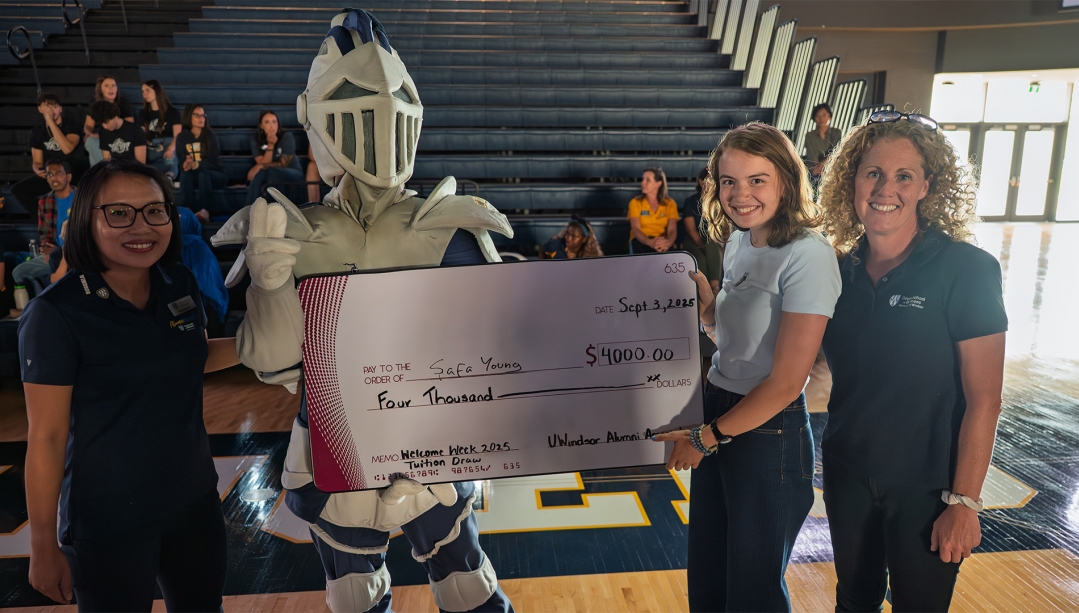 Dorothy Leung and Winston present Safa Young with grand prize ceremonial cheque along with Kelly Gosselin at Welcome Celebration.